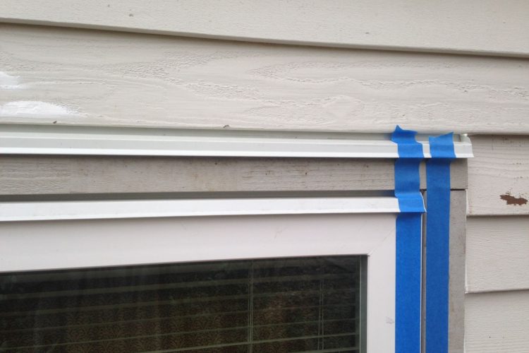 Proper double flashing on top of the window and cedar trim with 1/4 inch gap.