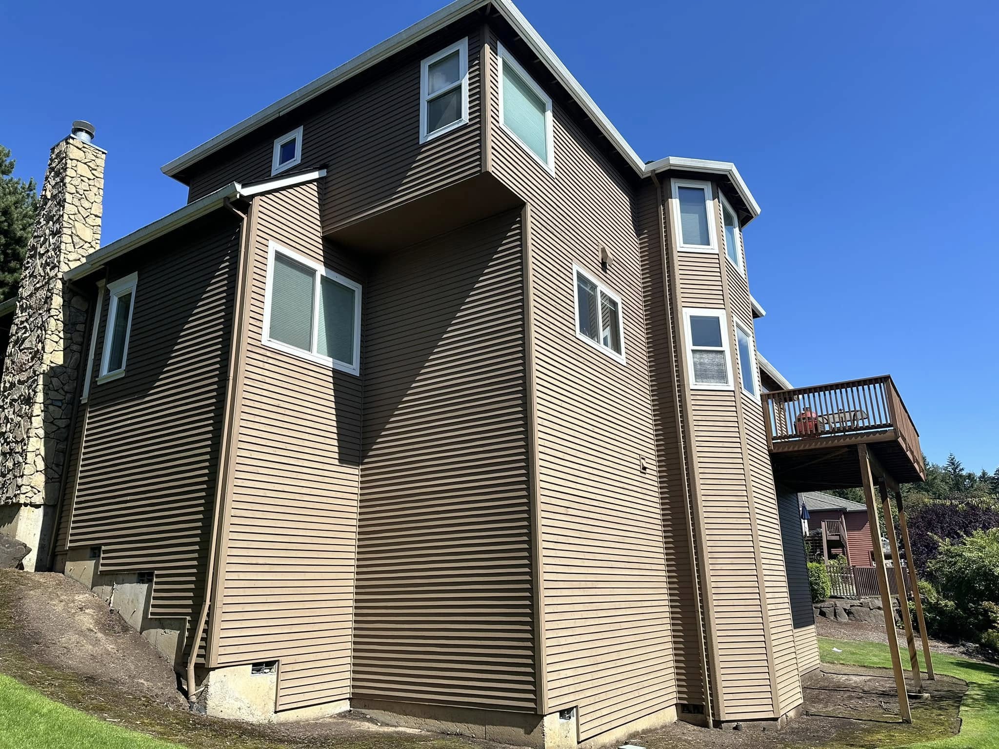 Brown James Hardie fiber cement siding on a Portland home after full siding replacement