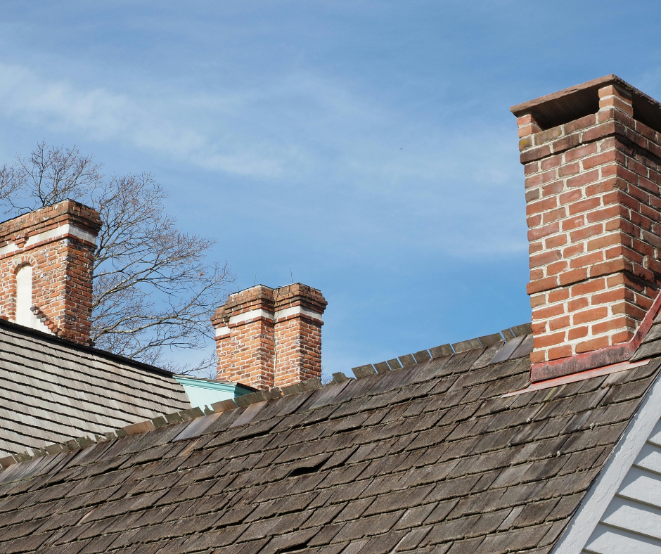 home with missing and cracked shingles on the roof